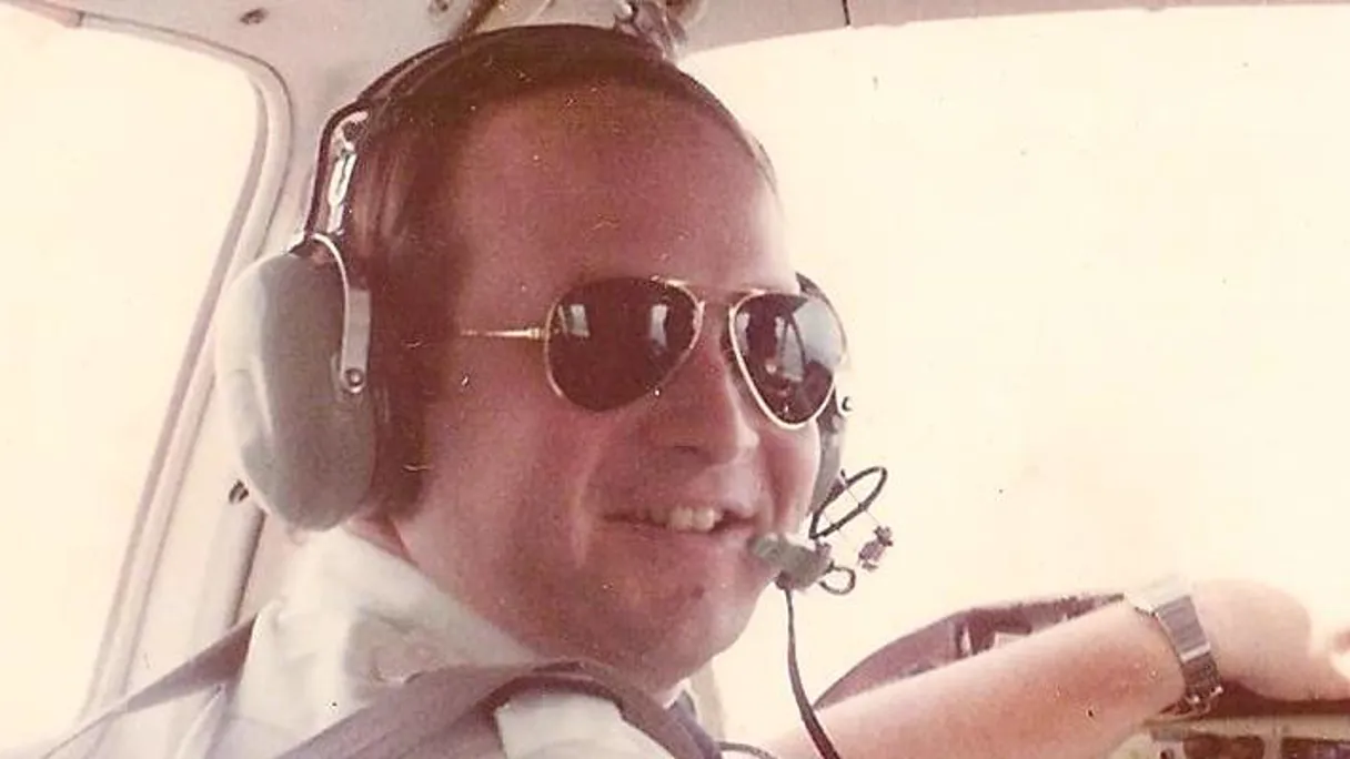 a person wearing sunglasses and headphones
