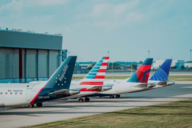 airplanes parked on a runway