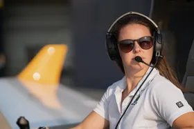a person wearing sunglasses and headphones