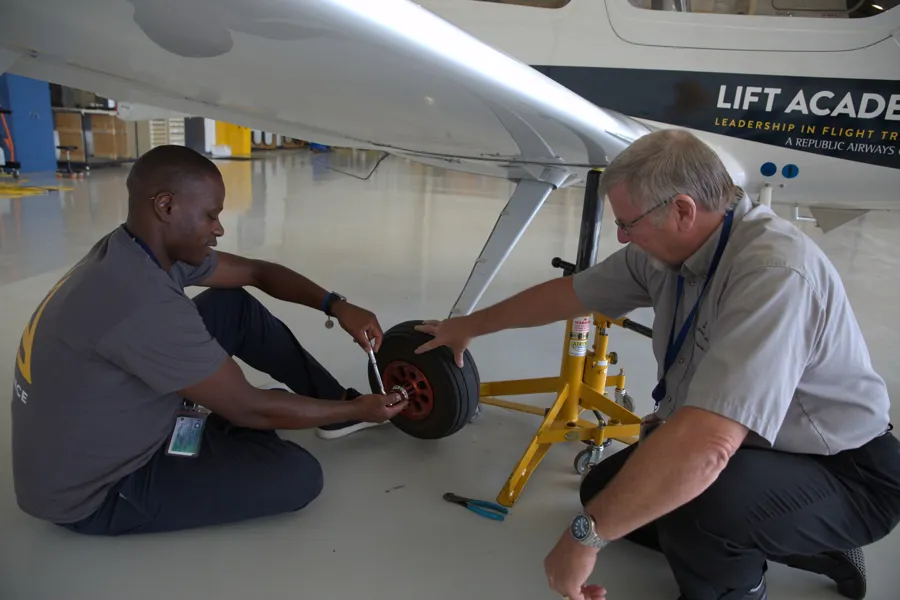 a person working on a tire