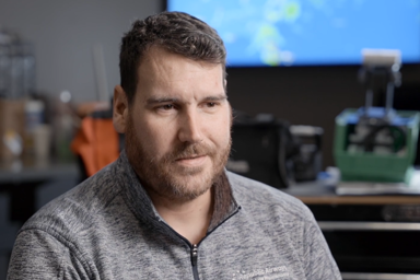 a person in a grey sweater