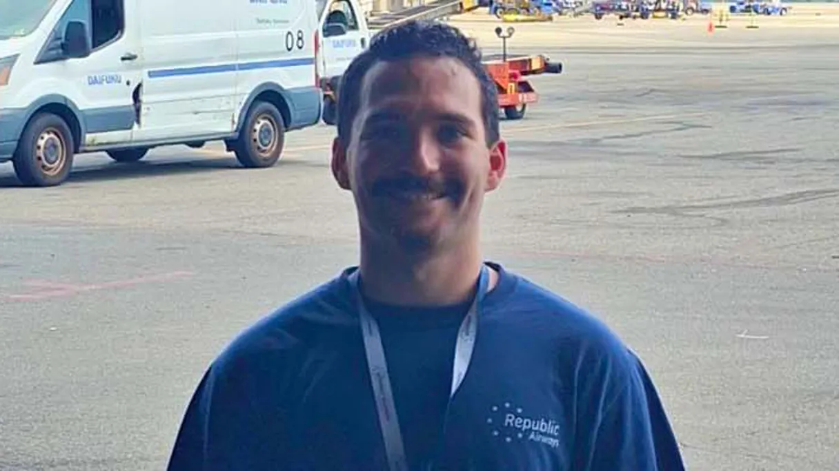 a person smiling at the camera