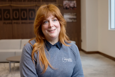 a person with red hair smiling
