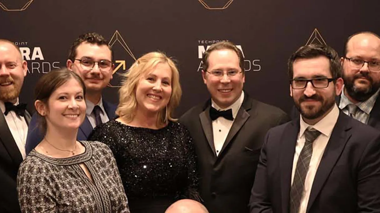 a group of people posing for a photo